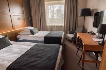 Фото номера Двухместный номер с 2 отдельными кроватями Отель Original Sokos Hotel Vaakuna Joensuu г. Йоэнсуу 8